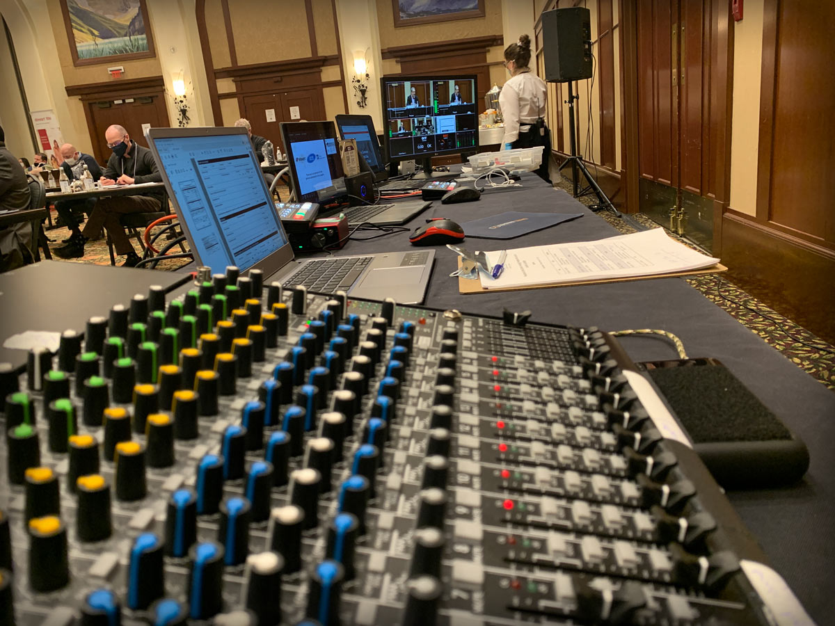 Microphones, mixer, laptops and projection equipment prepared for an Edmonton event