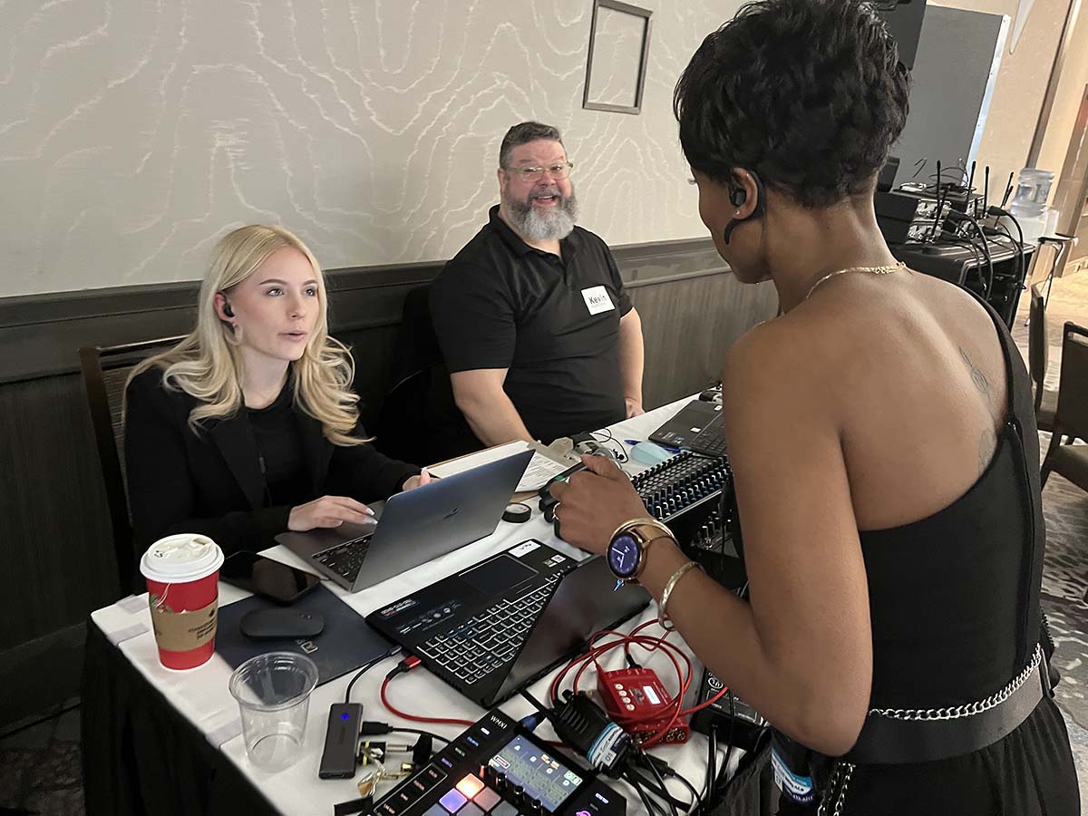 Seminar Techs team providing hands-on audio visual and hybrid meeting support at an Edmonton corporate event